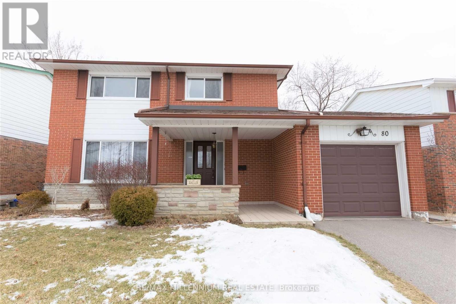 A house with a brown garage door is for sale.