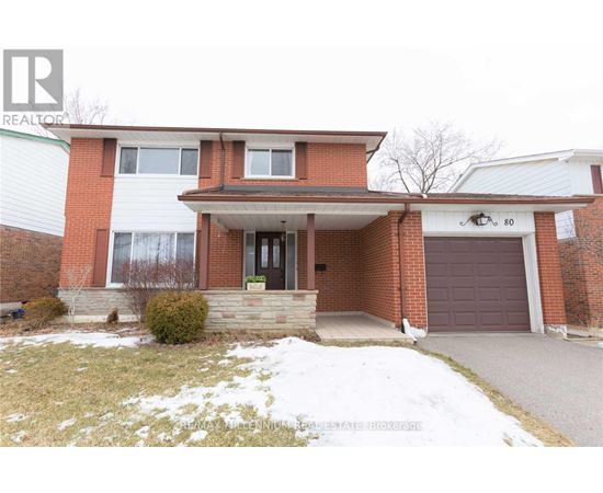 A house with a brown garage door is for sale.