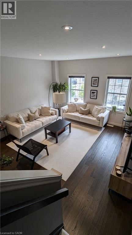 A living room with a white couch and a coffee table.