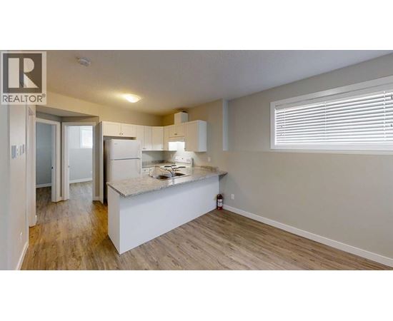 A realtor logo is on the top left corner of the image.