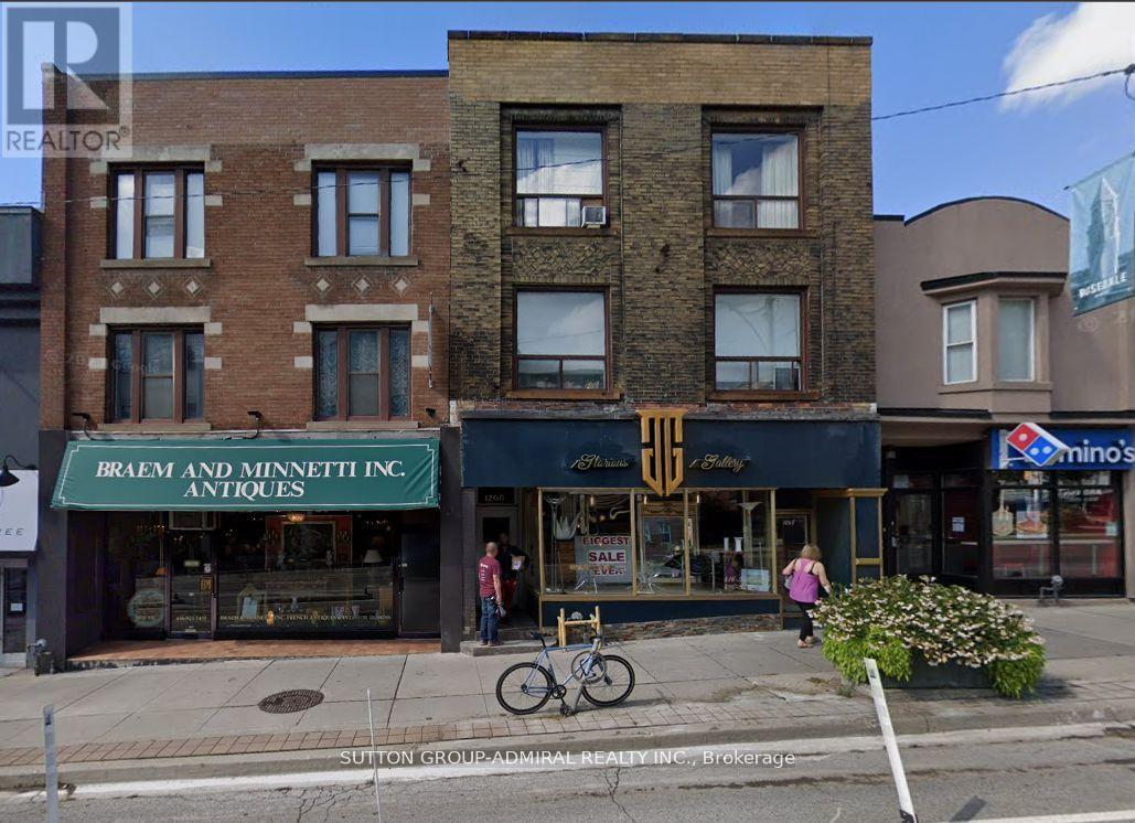 A street view of a building with a sign that says Braem and Minnett Inc. Antiques.