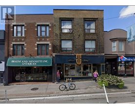 A street view of a building with a sign that says Braem and Minnett Inc. Antiques.