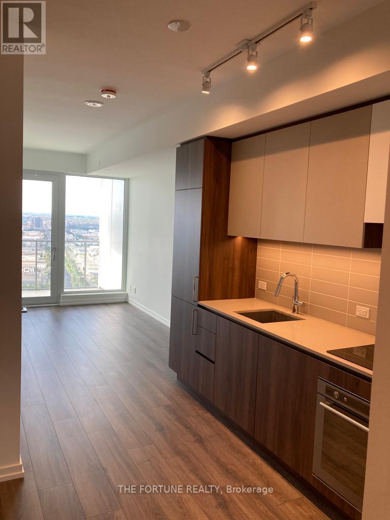 A kitchen with wooden cabinets and a sink.