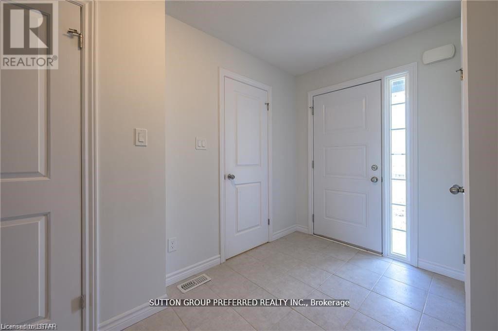 A room with white walls and a tiled floor.