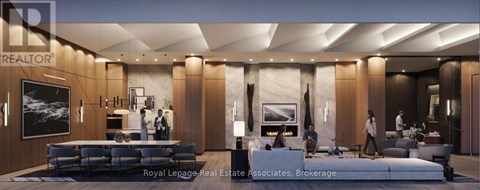 A modern living room with a large couch and a television.