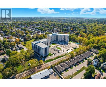 A bird's eye view of a residential area with a large building in the center.
