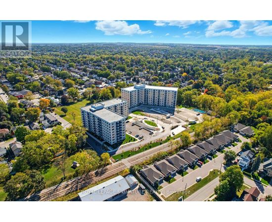 A bird's eye view of a residential area with a large building in the center.