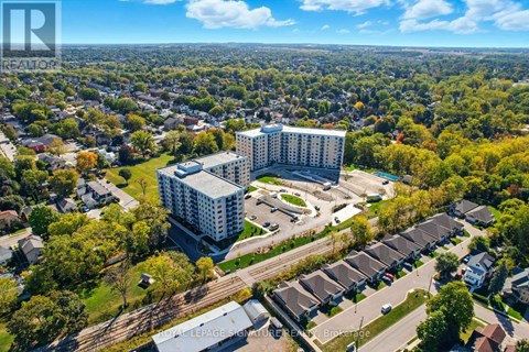 A bird's eye view of a residential area with a large building in the center.