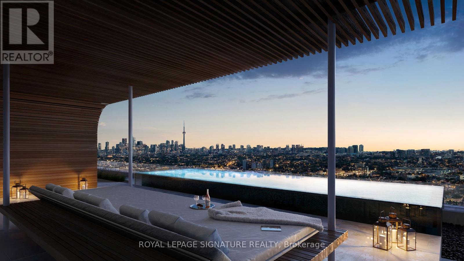 A luxurious outdoor living space with a pool and a view of the city skyline.