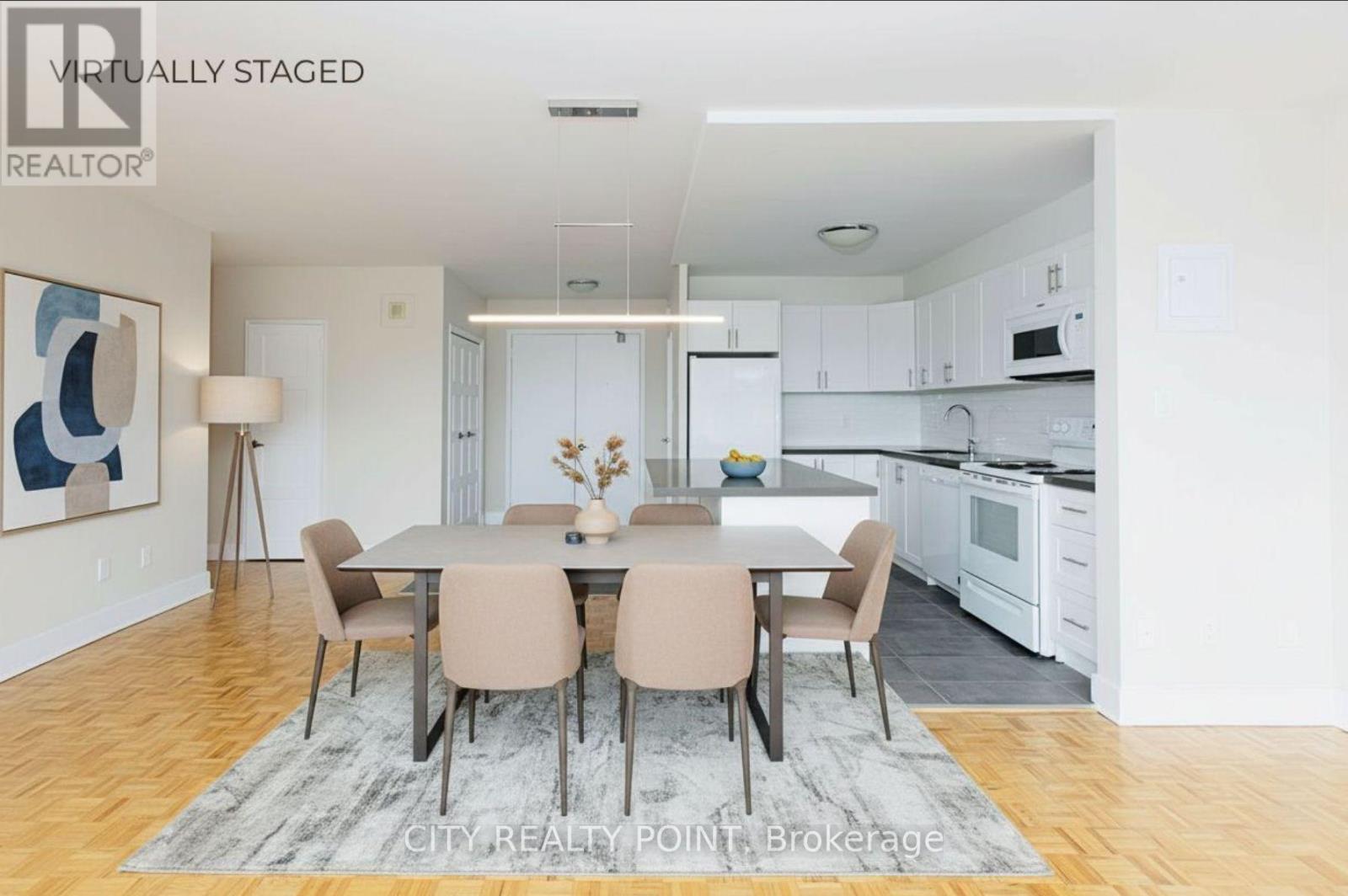 A dining room with a table set for six.