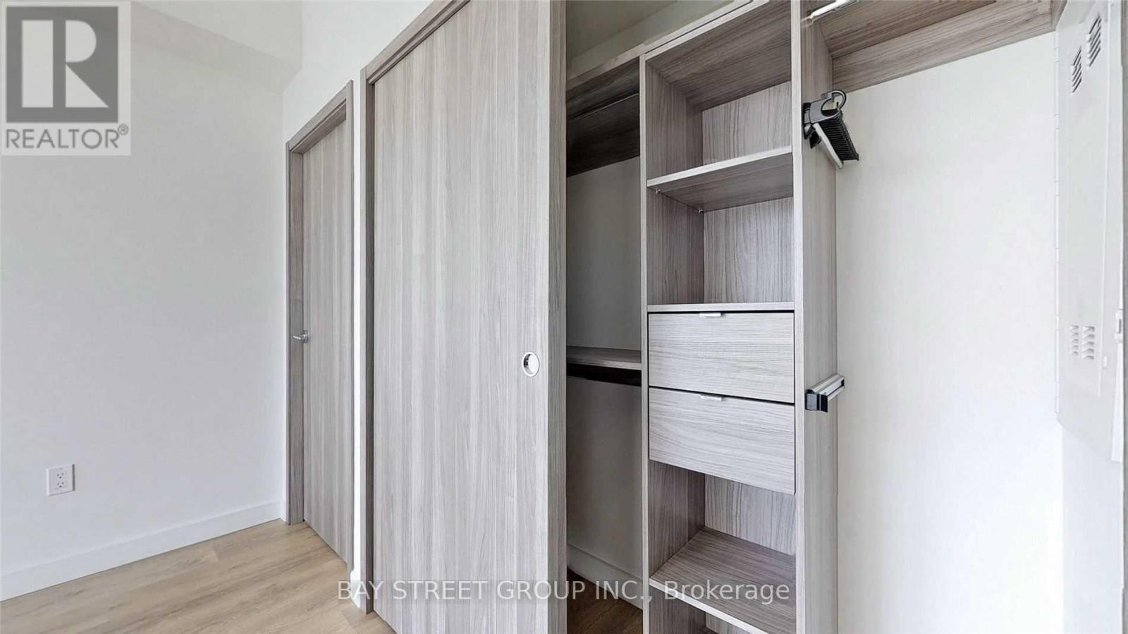 A realtor photo of a bedroom with a wardrobe.