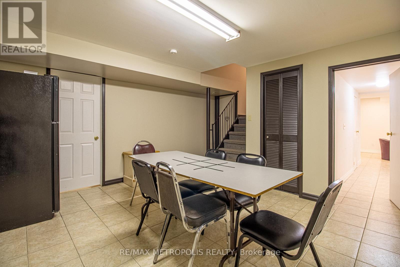 A dining room with a table and chairs is shown.