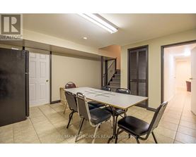A dining room with a table and chairs is shown.