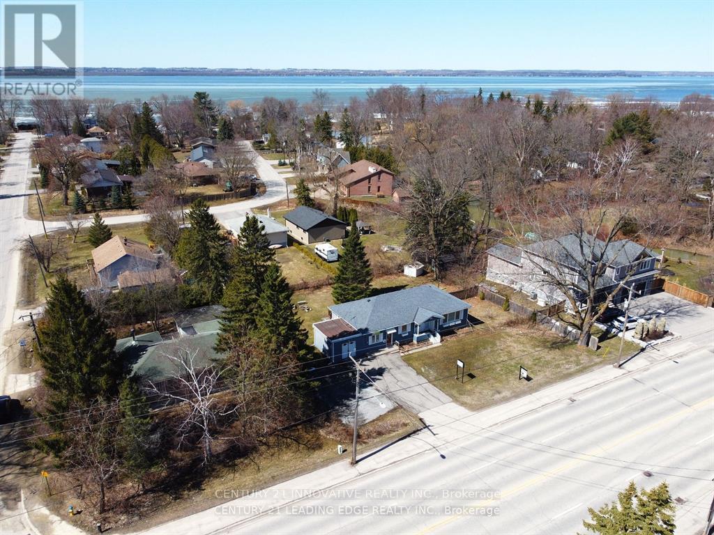 A bird's eye view of a residential area with houses and trees.