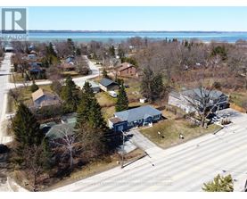 A bird's eye view of a residential area with houses and trees.