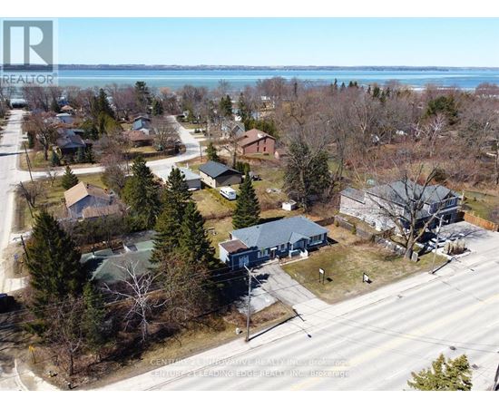 A bird's eye view of a residential area with houses and trees.