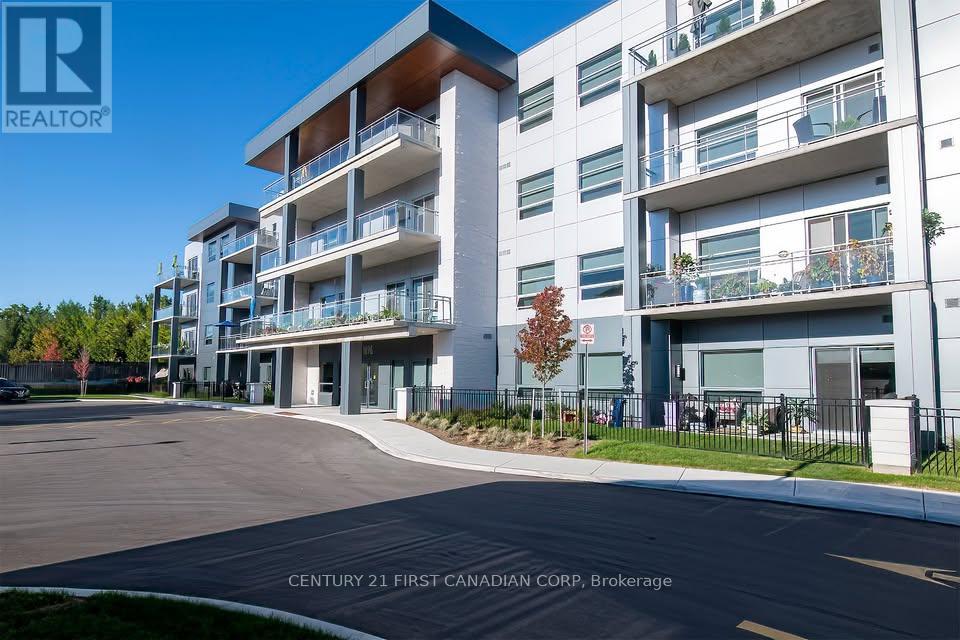 A modern apartment complex with a clear blue sky in the background.