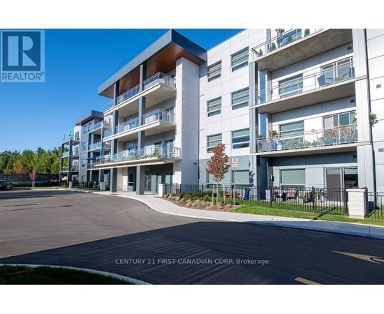 A modern apartment complex with a clear blue sky in the background.