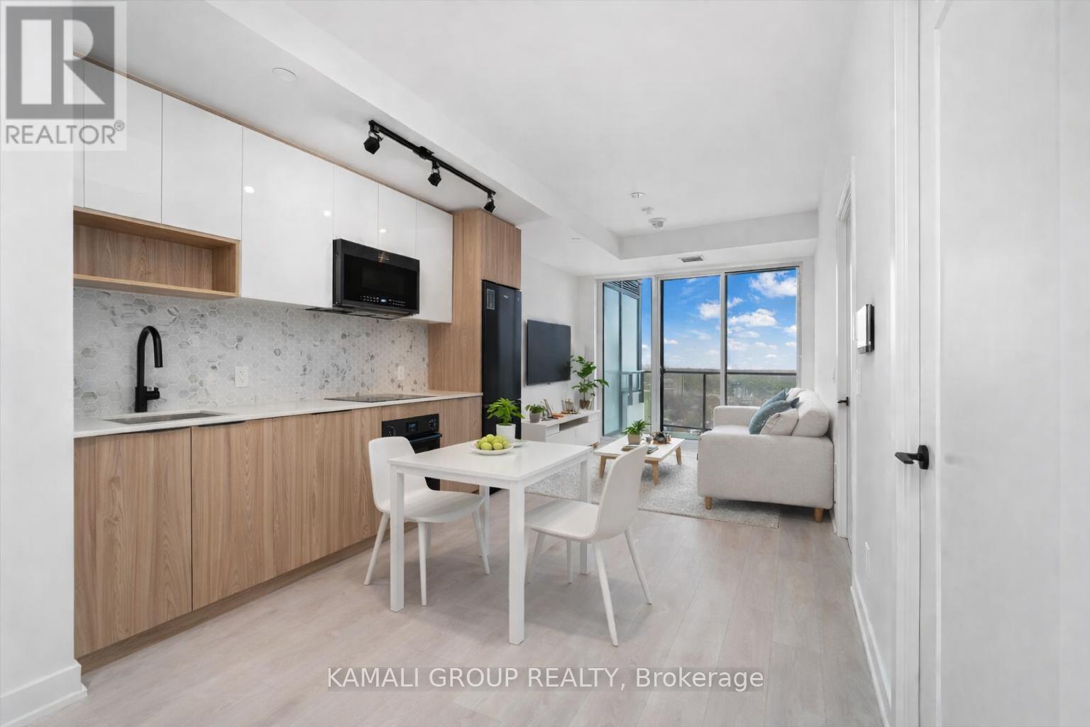 A modern kitchen with wooden cabinets and a white countertop.