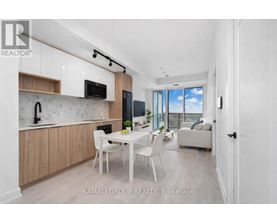 A modern kitchen with wooden cabinets and a white countertop.