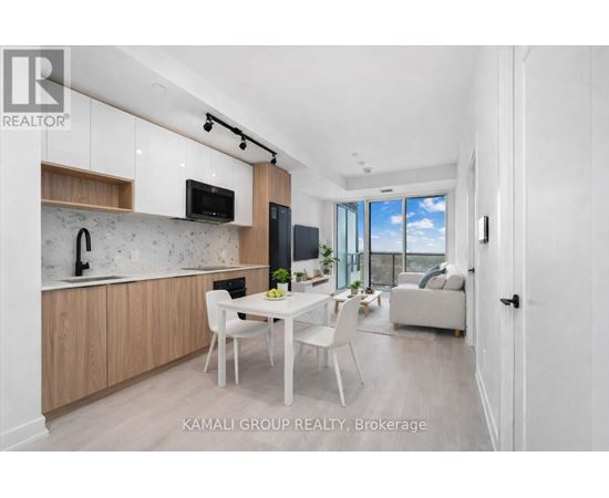 A modern kitchen with wooden cabinets and a white countertop.