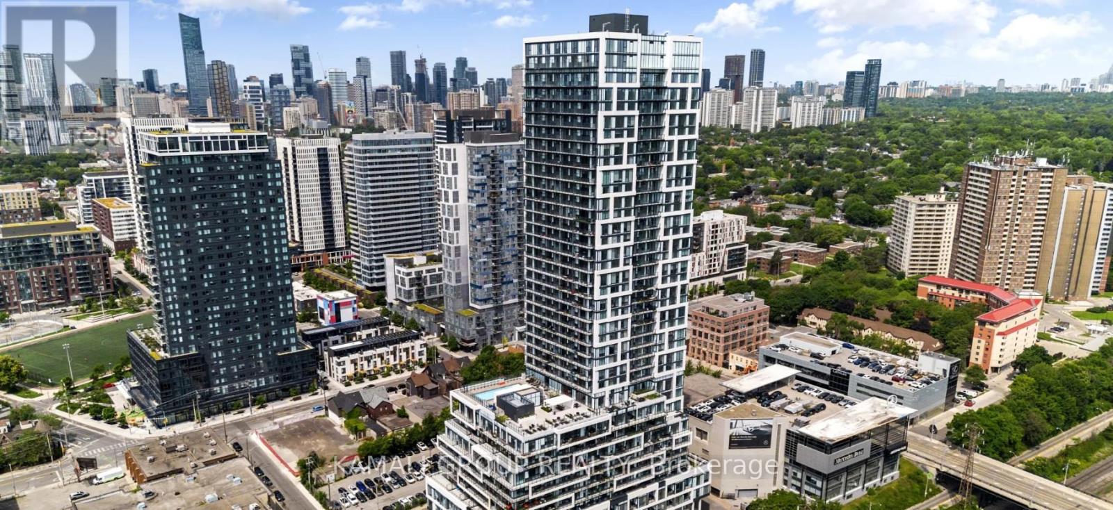 A cityscape with tall buildings and a clear sky.