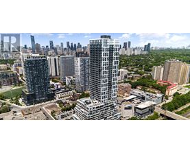 A cityscape with tall buildings and a clear sky.