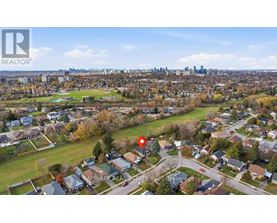 A bird's eye view of a residential area with a red marker indicating a specific location.