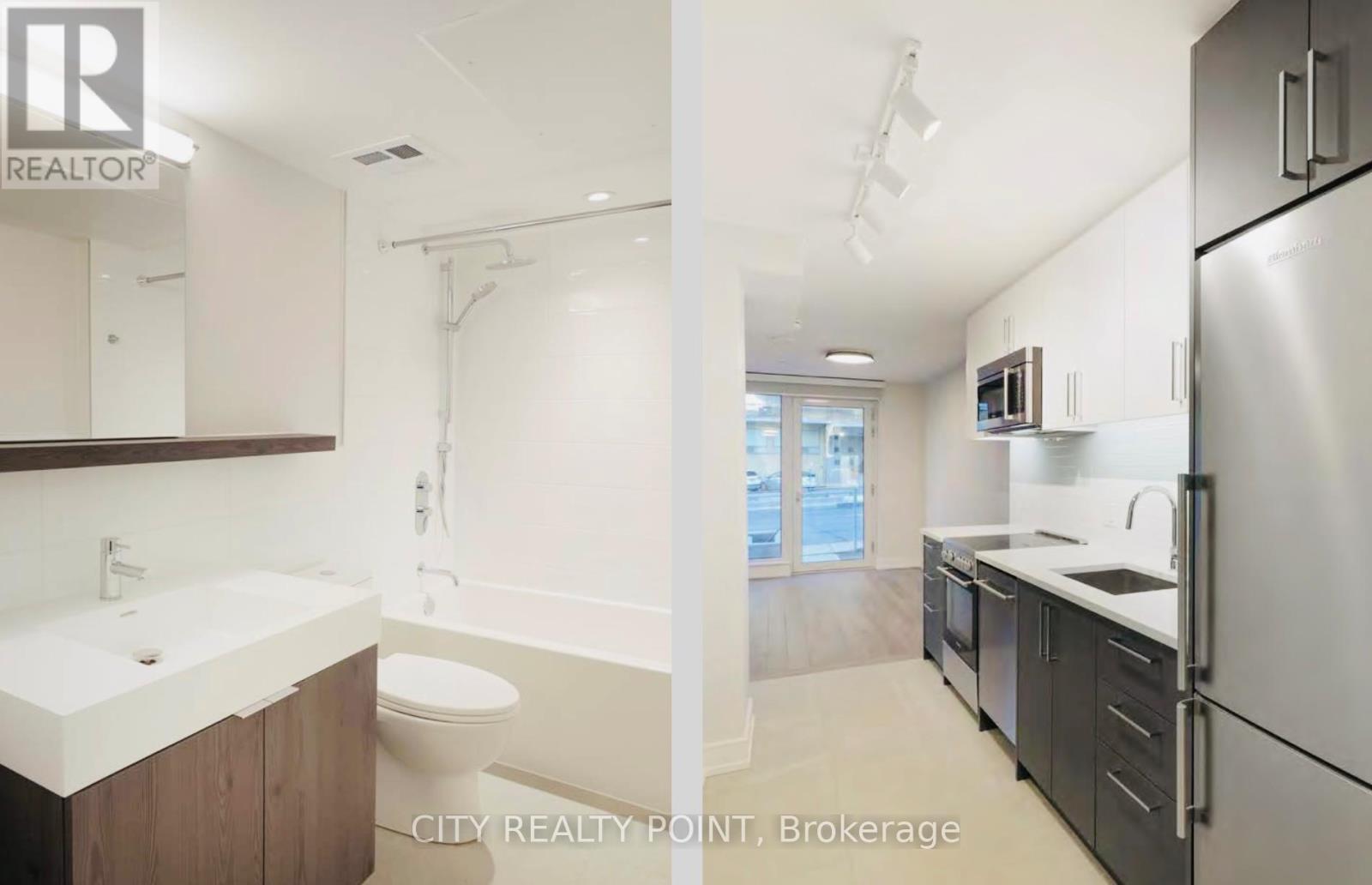 A modern kitchen with a refrigerator, sink, and cabinets.