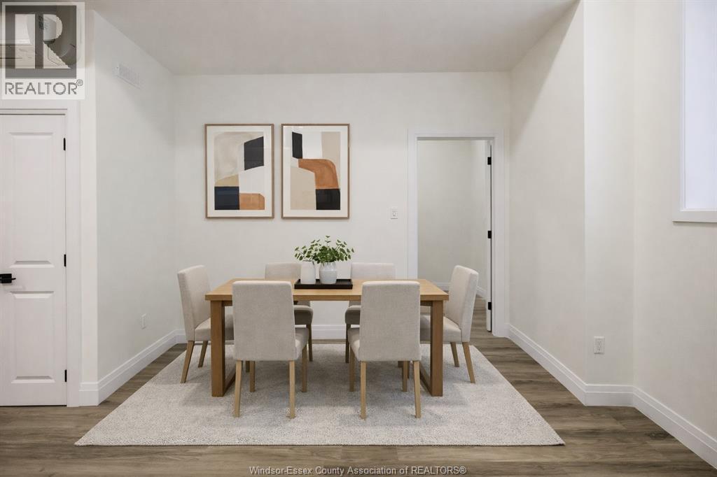 A dining room with a table set for two.