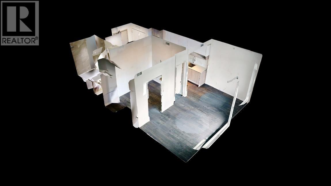 A white, multi-level house with a black background.