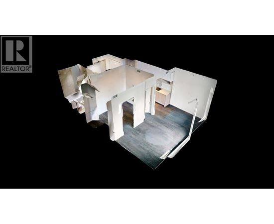 A white, multi-level house with a black background.