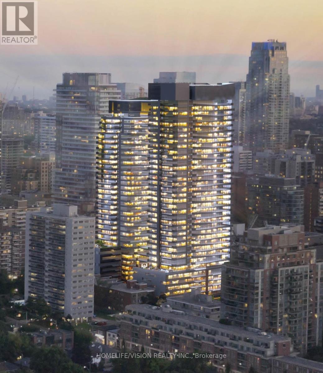 A cityscape with a tall building in the foreground and other buildings in the background.