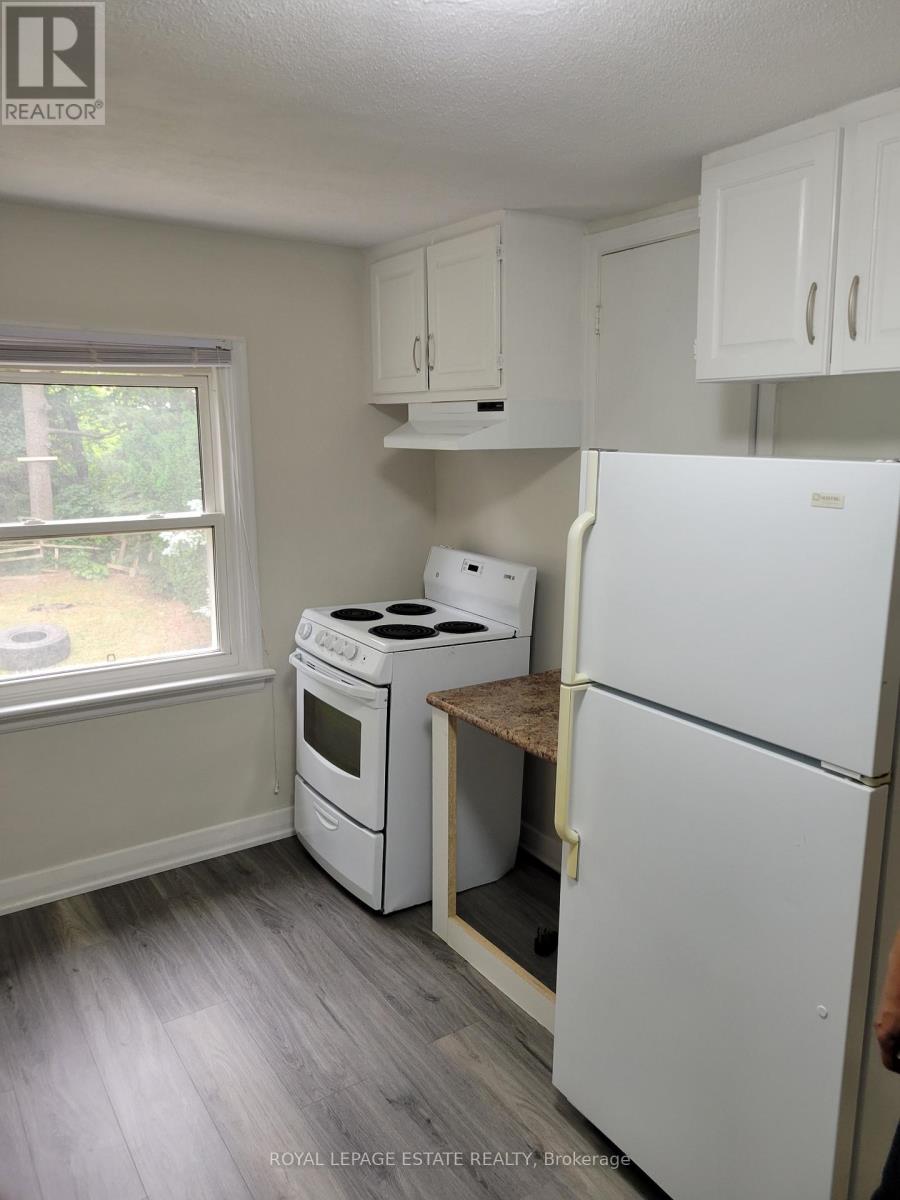 A white refrigerator with the door open in a kitchen.