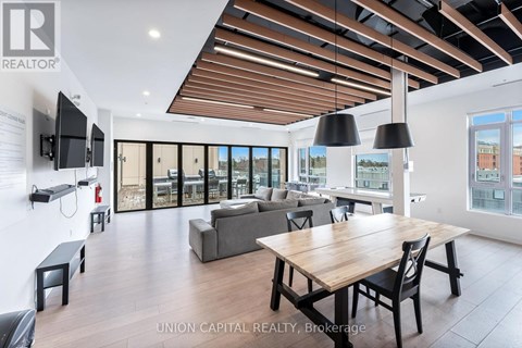A modern living room with a wooden table and chairs.