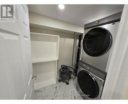 A laundry room with a washer and dryer.