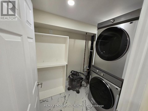 A laundry room with a washer and dryer.