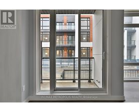 A view of a balcony from a window in a building.