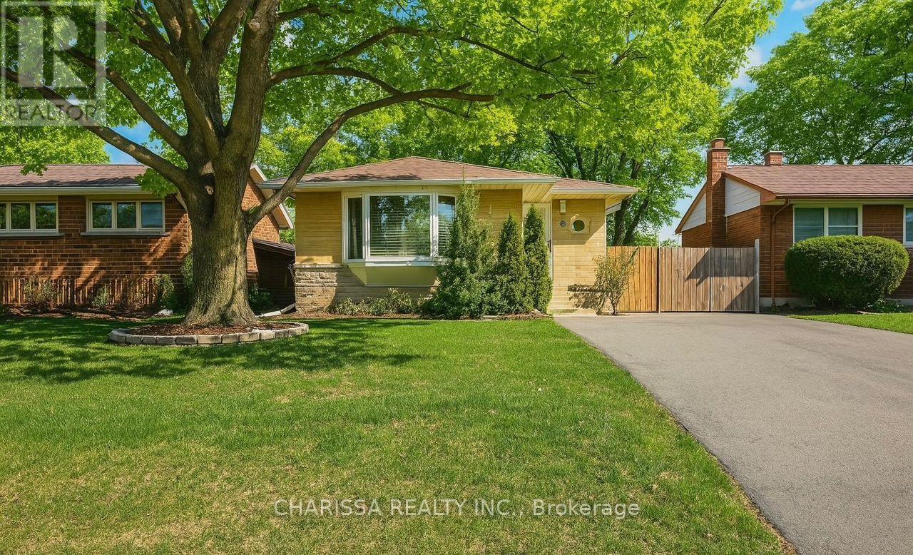 A house with a tree in front of it.