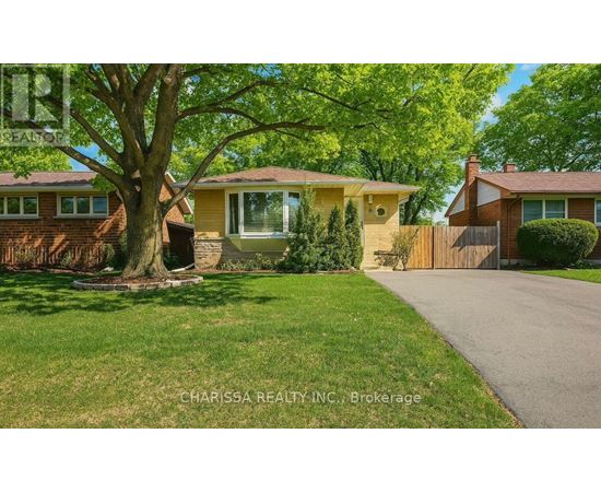 A house with a tree in front of it.