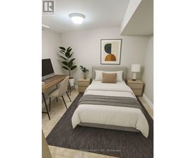 A bedroom with a bed, desk, and chair.