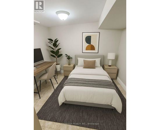 A bedroom with a bed, desk, and chair.