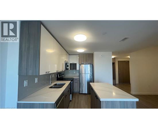 A modern kitchen with a large island in the middle.
