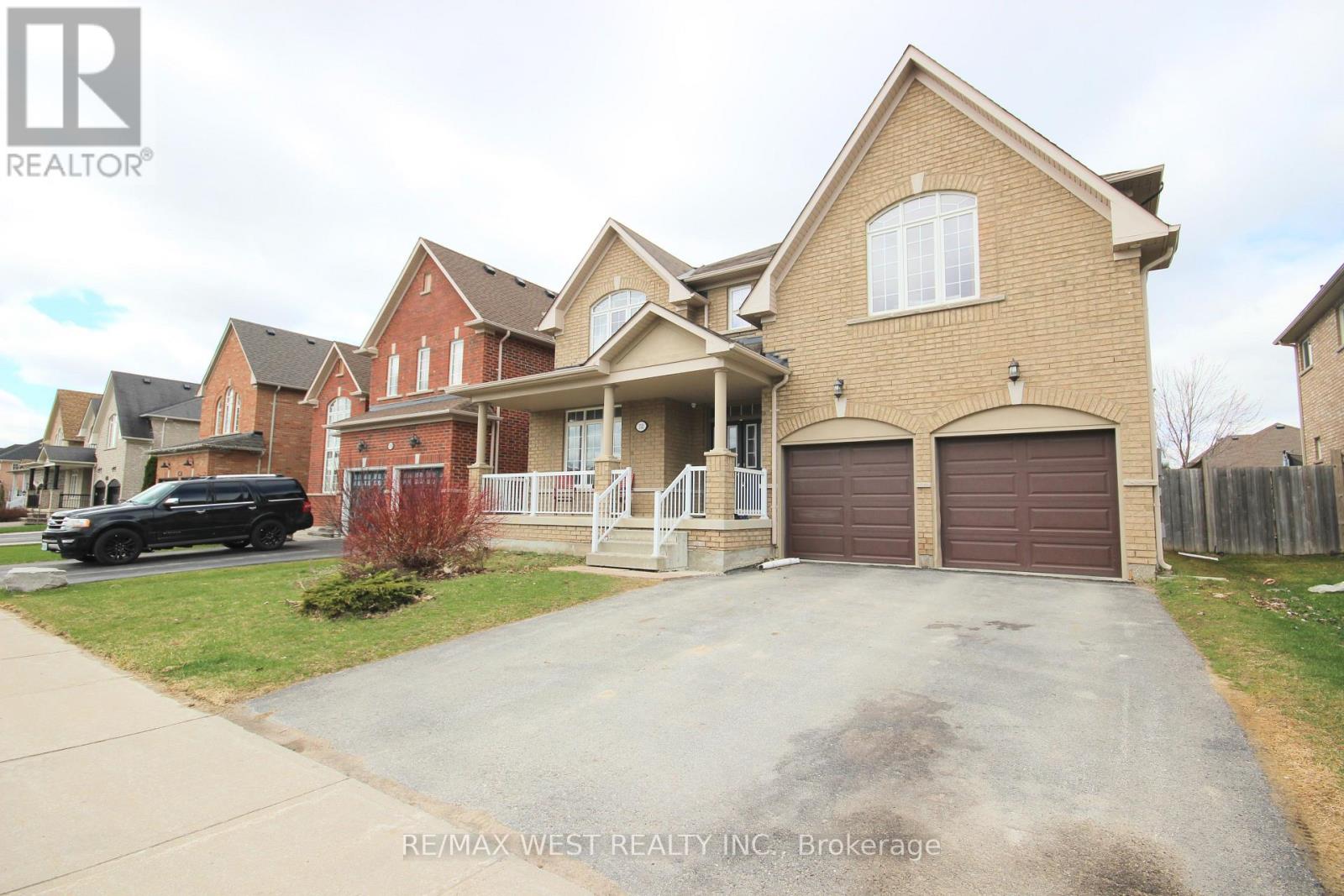 A house with a brown garage door is for sale.