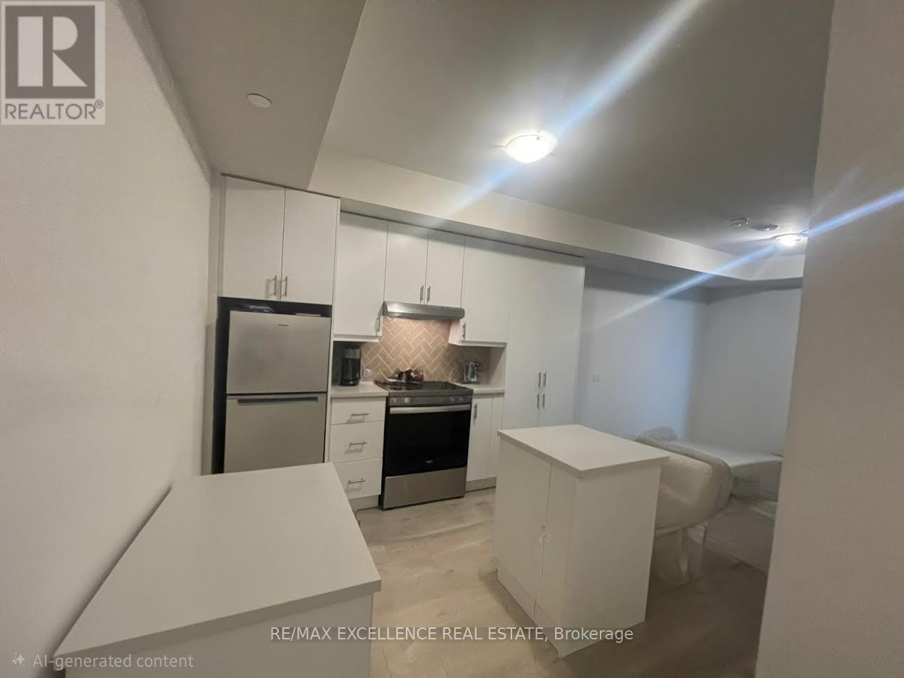 A modern kitchen with white cabinets and appliances.