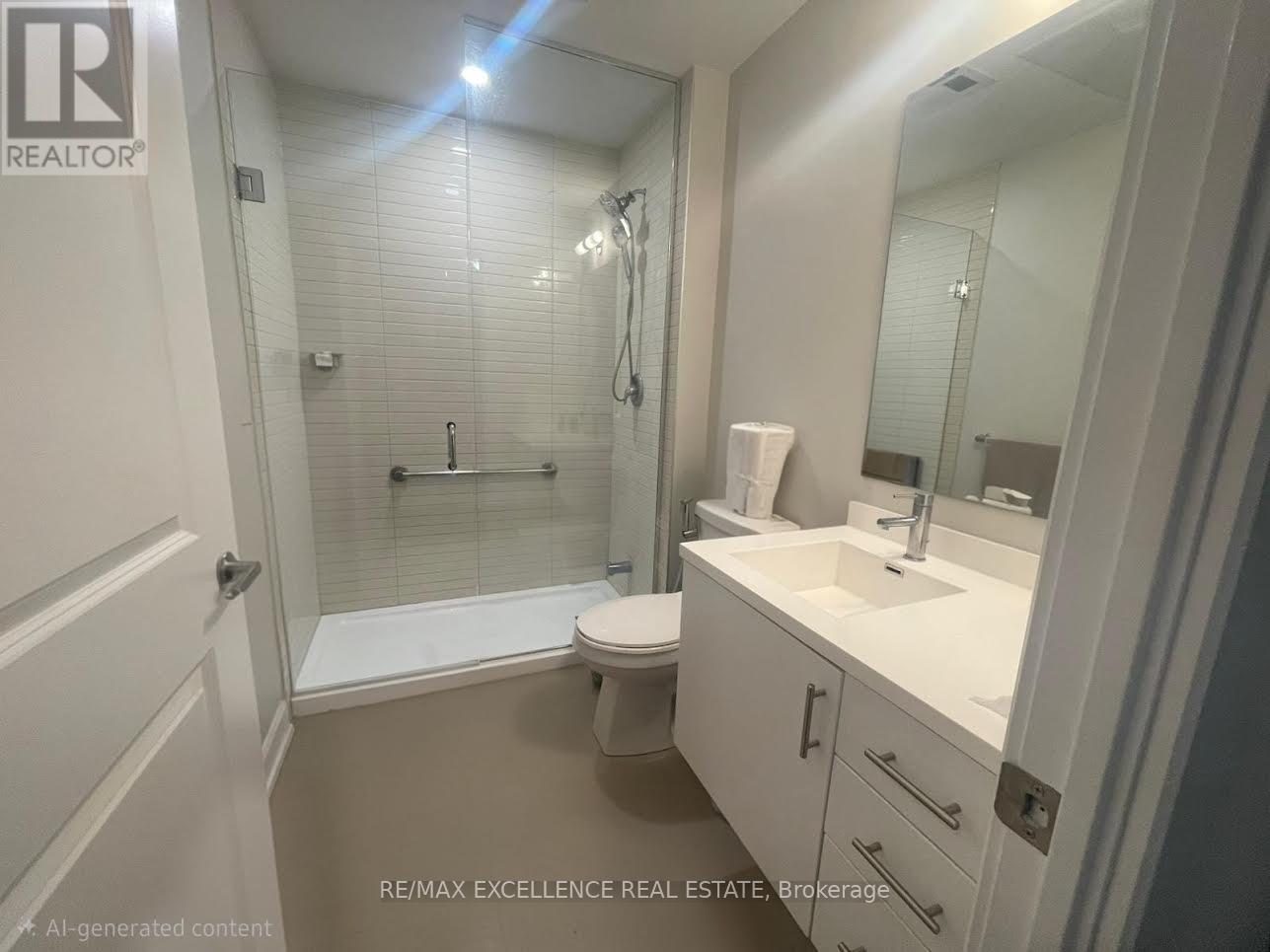 A white bathroom with a toilet, sink, and shower.