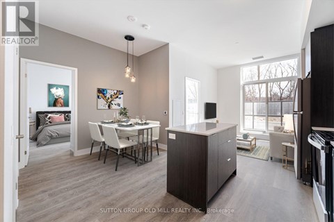 A modern kitchen with a dining table and chairs.