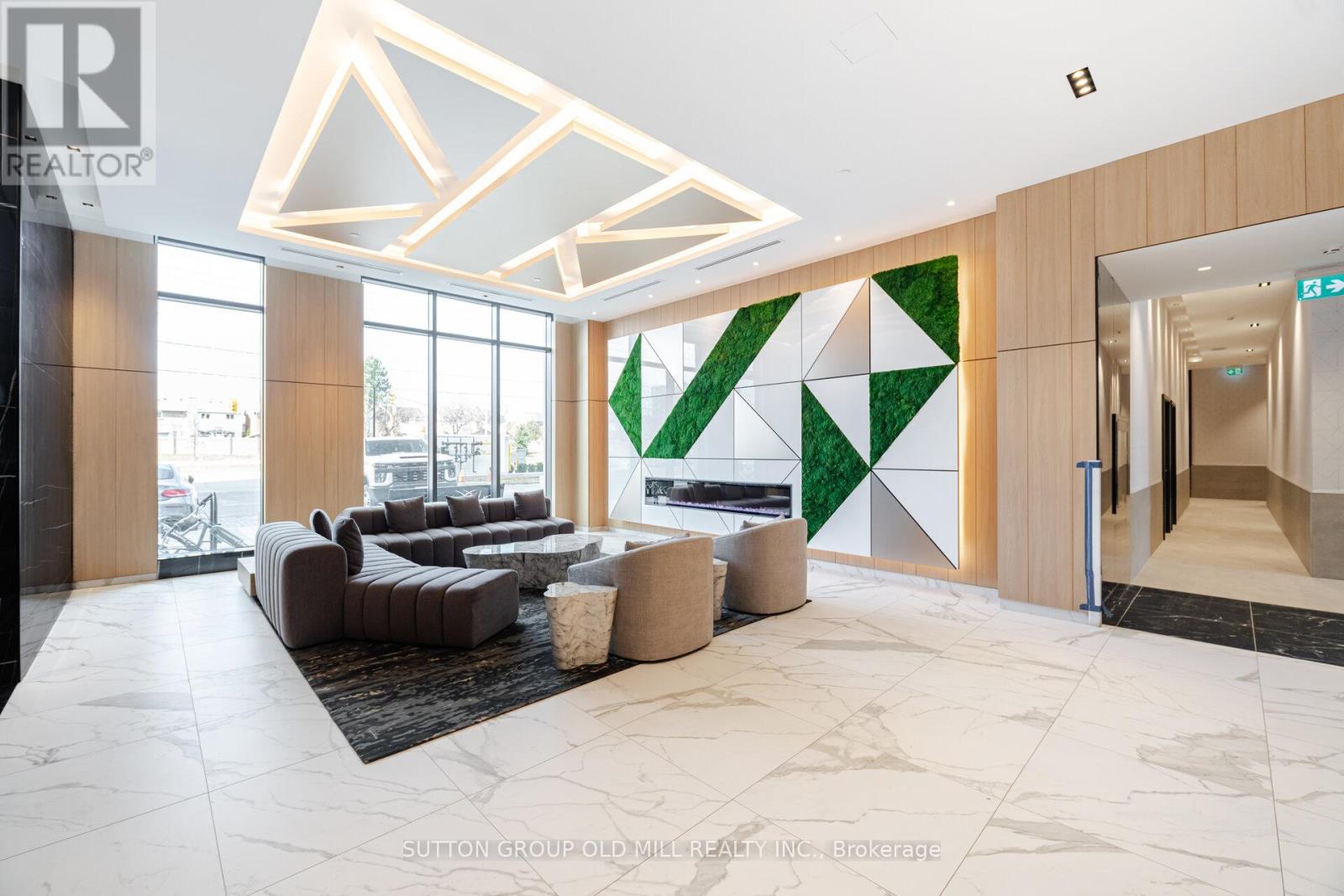 A modern interior space with a green geometric wall design.