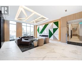 A modern interior space with a green geometric wall design.