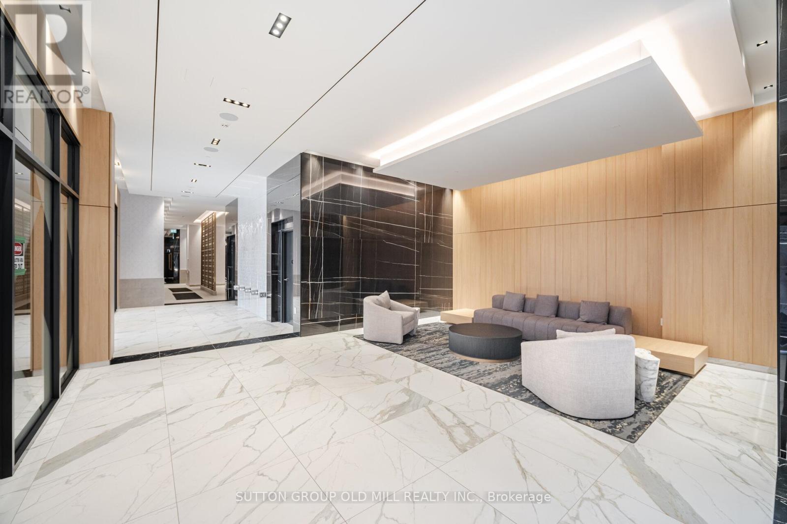 A modern living room with a marble floor and a wooden accent wall.